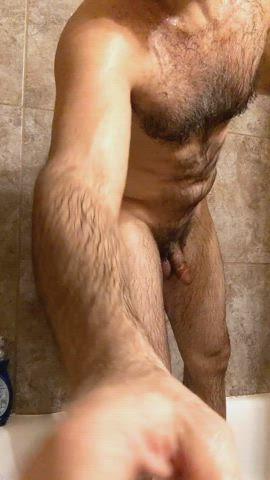 Towel drying my hairy body after a shower