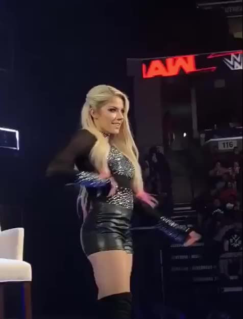 Alexa Bliss showing off her outfit.