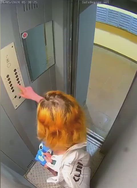 Redhead peeing in an elevator