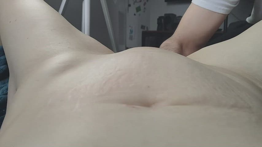 a different view during fisting, with a bit of a belly bulge.