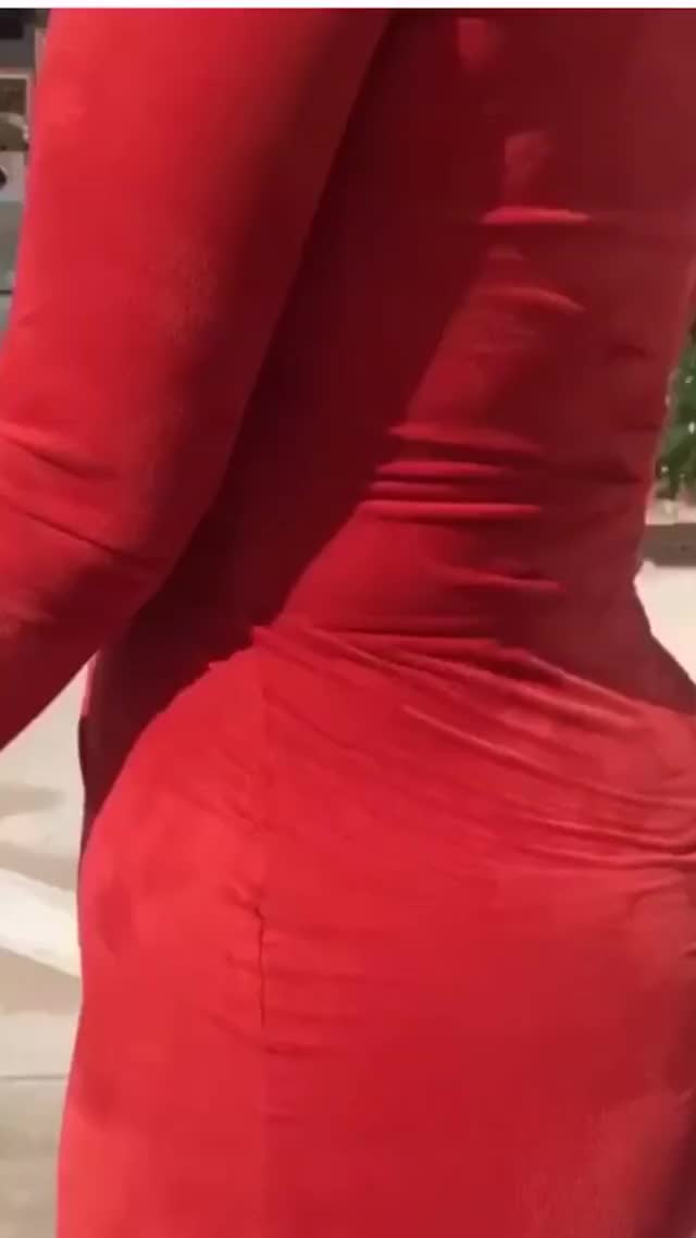 Sophie Eloise in tight red dress walking