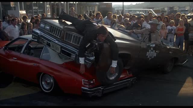 Smokey-and-the-Bandit-1977-GIF-00-56-21-junior-on-the-hood