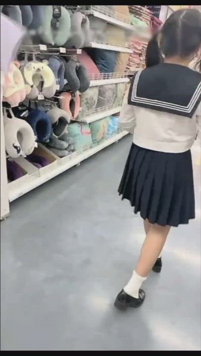 20 year old asian dress up as student in public supermarket