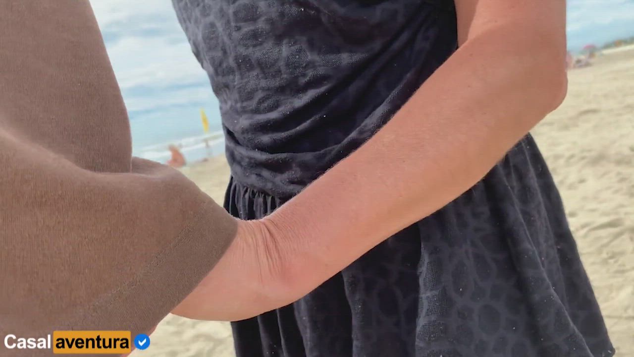 Handjob on the beach very close to people