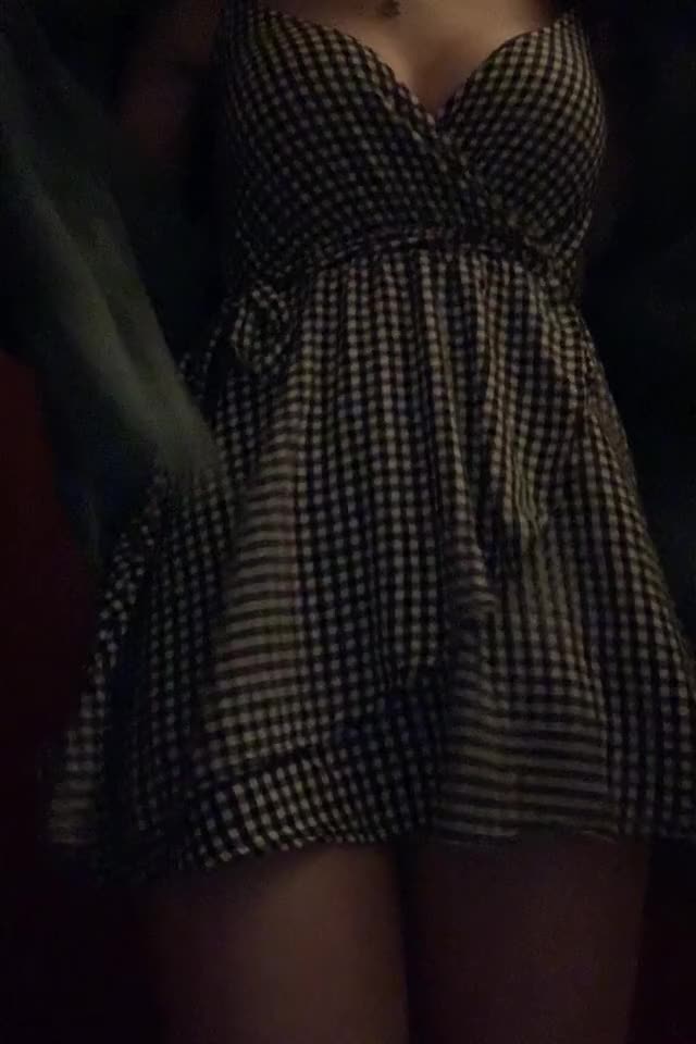 showing off her dinner outfit in the restaurant bathroom