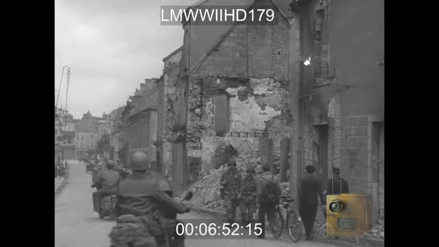 American wreckers team up to move a wrecked German self-propelled gun