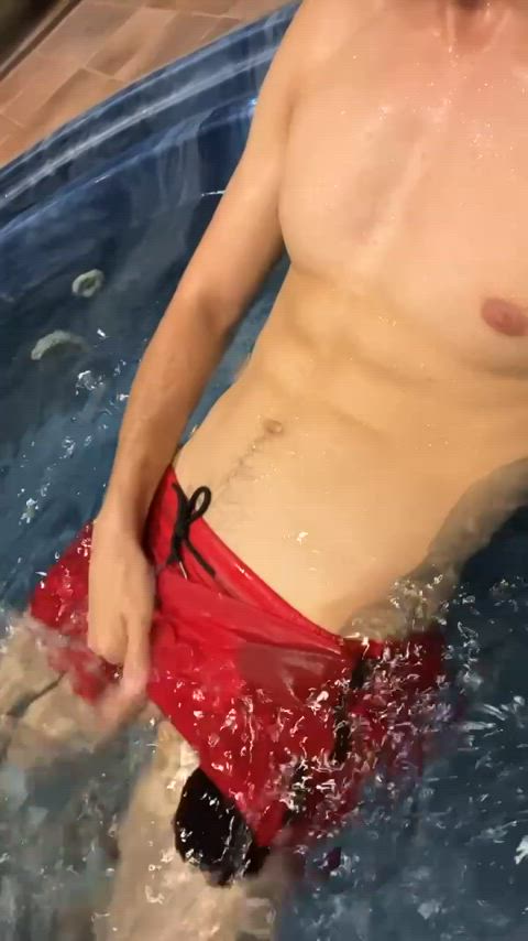 Playing with my cock in the hot tub