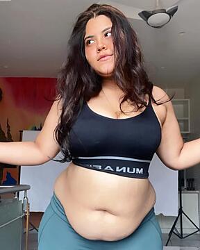 any idea who she is, her belly is making me lose it