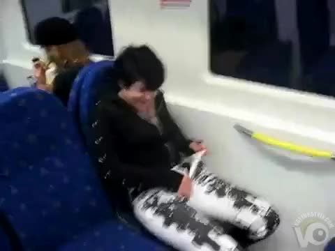 She sprays the train seat
