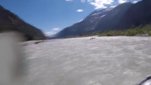 Grizzly Bear Charges Kayaker While Rafting Down A River