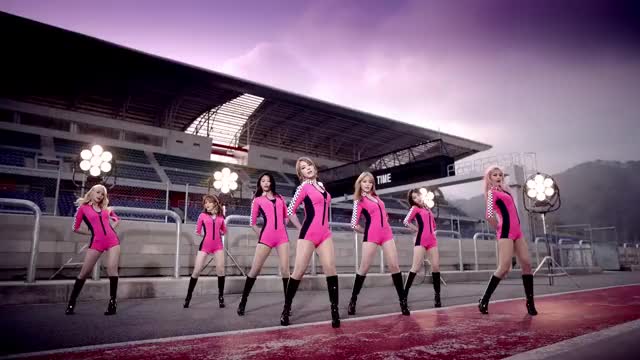 Choa does body rolls in a one-piece racequeen suit