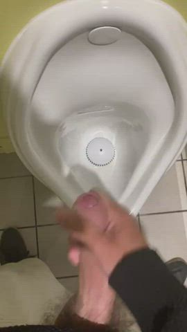 Cumming at the urinal