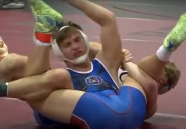 College wrestler in tight singlet gets "exposed" in front of entire crowd