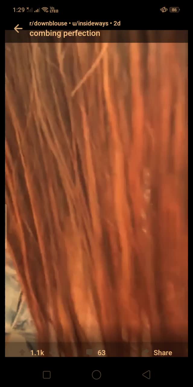 Girl combing her hair with jiggle tits