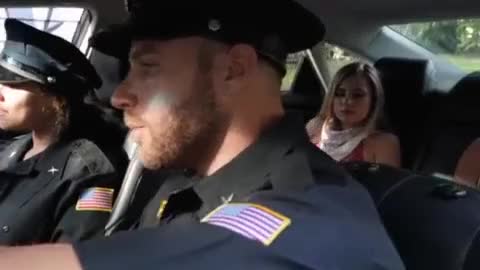 Sneaky blowjob in the squad car