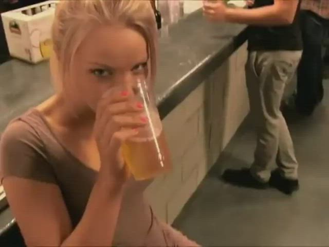 Super hottie drinking beer and flashing in a bar