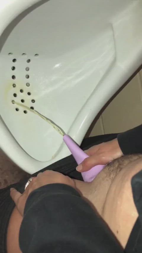 She uses a urinal for the first time