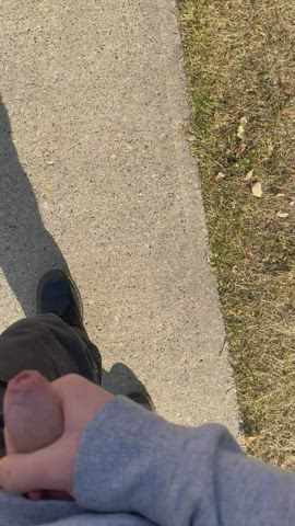 cumming on the sidewalk