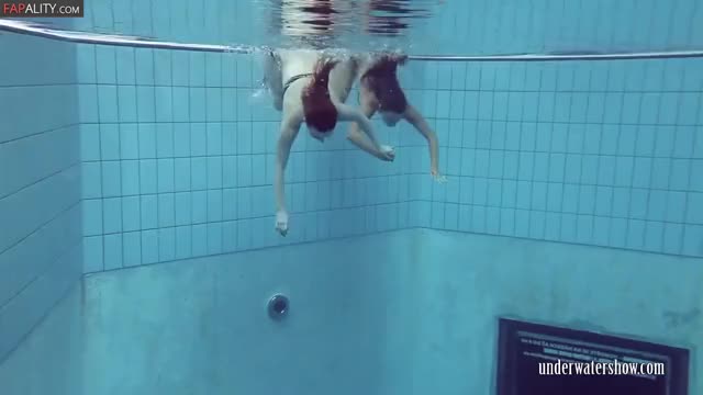 Two nude teens underwater show