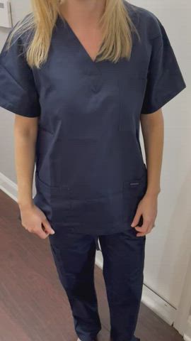 Doctor flashing in scrubs