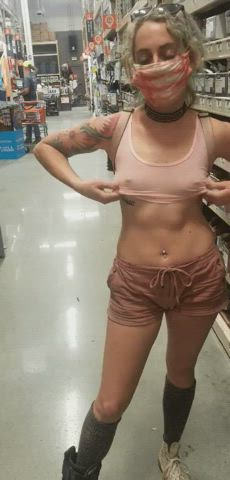 Blonde flashing the hardware store