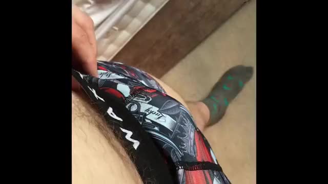 Cock reveal through boxers