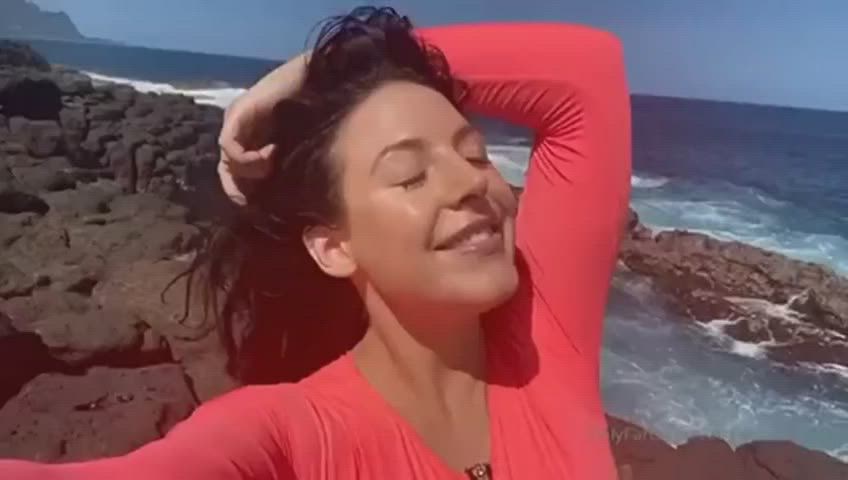 Huge boobs by the ocean