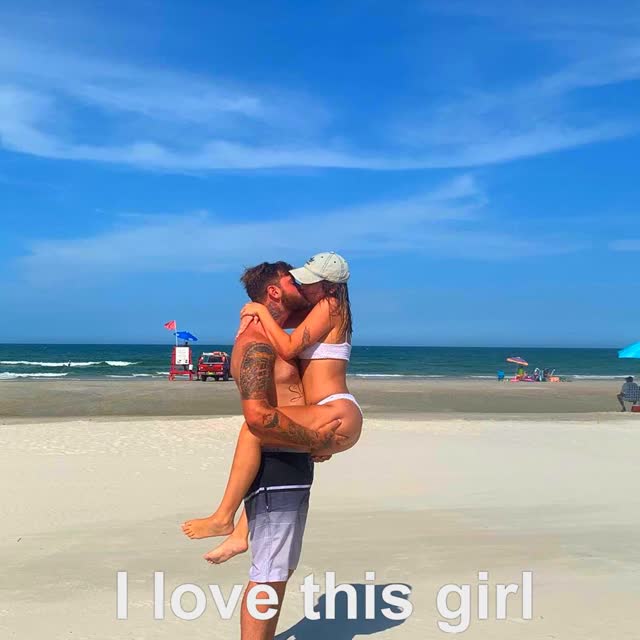 couple kissing on the beach