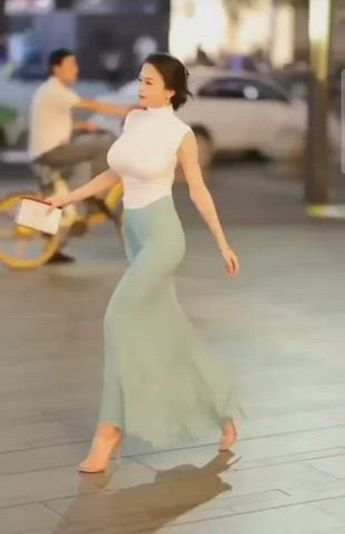 Asian lady bouncing along