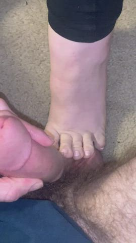 My gorgeous wife using her cute feet to tease and play with my blue balls