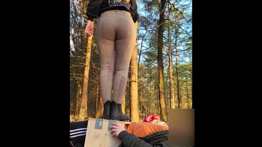 Cockcrush under riding boots with good view of her legs and butt