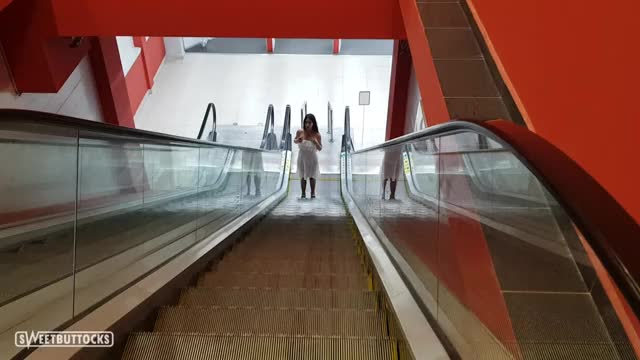 Showed her boobs on the escalator