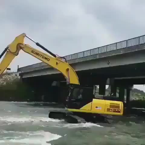 A wild excavator taking a bath in a river