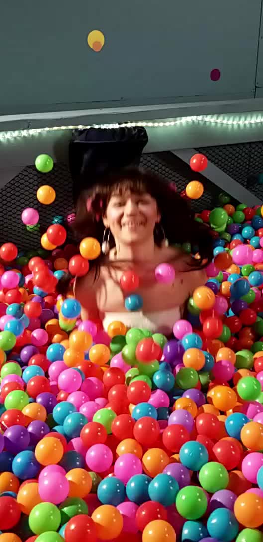 Kiki Cali having ball pit fun on set