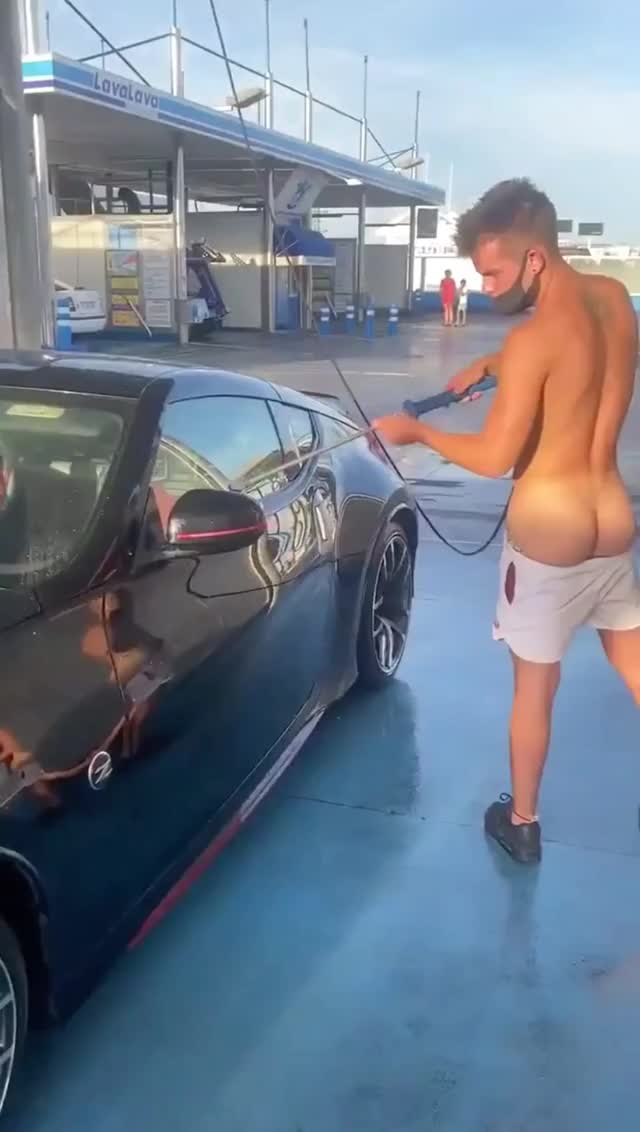 Washing his car while socially distancing