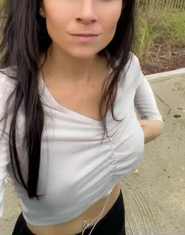 Flashing her perky tits outside