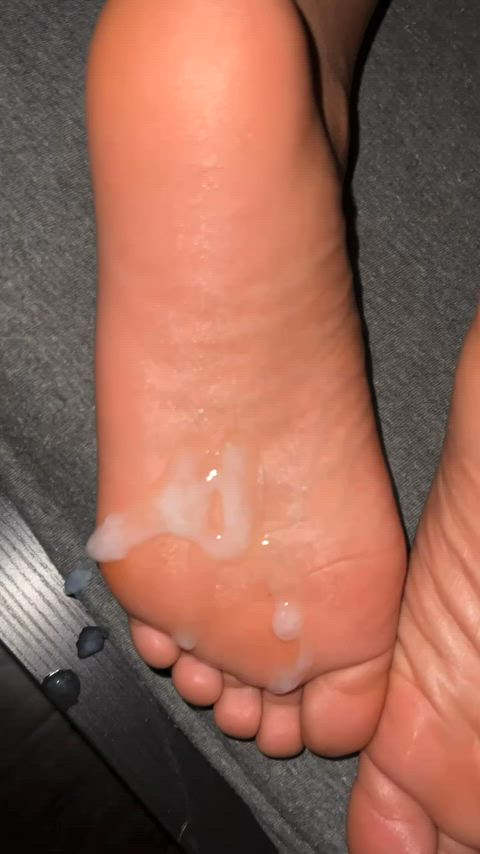 Sticky cumshot on her sleeping soles. I rubbed it in after this