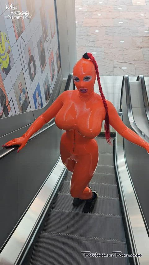 big tits catsuit corset heels high heels latex latex gloves mask public rubber gif