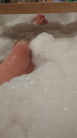 Having a lovely bath with loads of foam