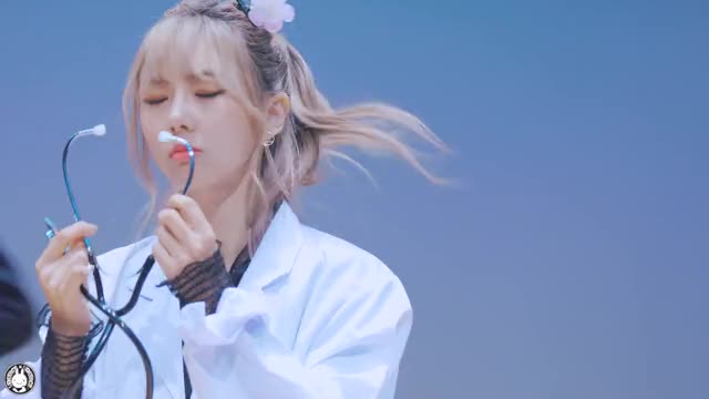 Yoohyeon checking her own pulse