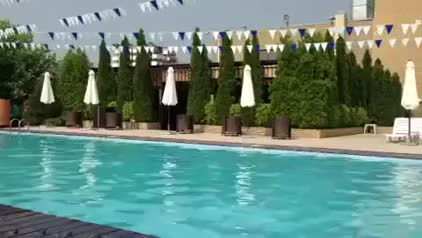 Lady jumps in pool and looses top