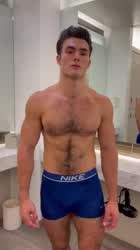 Flexing in blue underwear