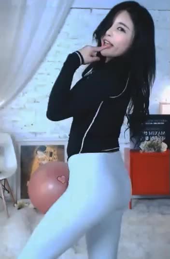 Cute Asian girl dancing in tight leggings