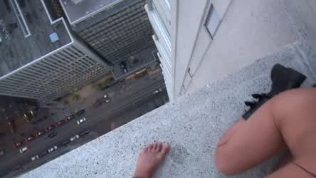 Nude And Sucking Atop A Skyscraper Ledge