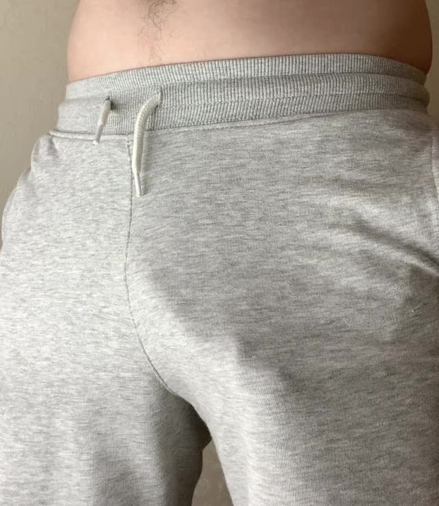 Dick into grey pants