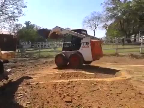 Parking Bobcat inside a truck.