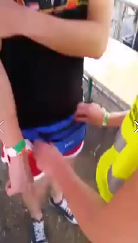 female security checks guys fanny pack at a festival