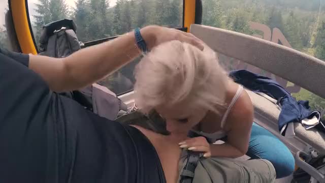 Using her mouth to jerk off on a ski lift