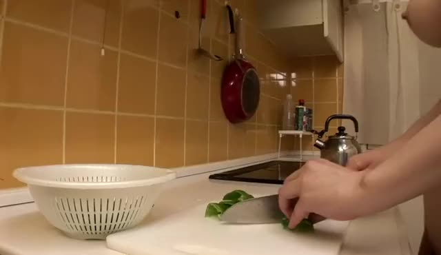 cutting up some green bell peppers while getting her ass eaten