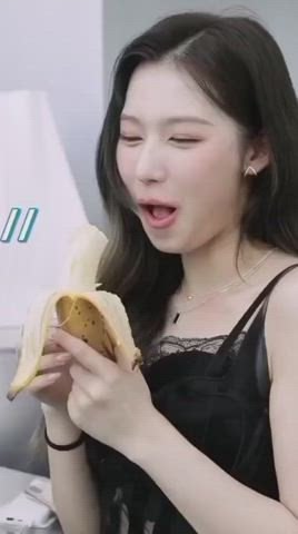 Sana enjoying banana and know well what we thinking.🤤